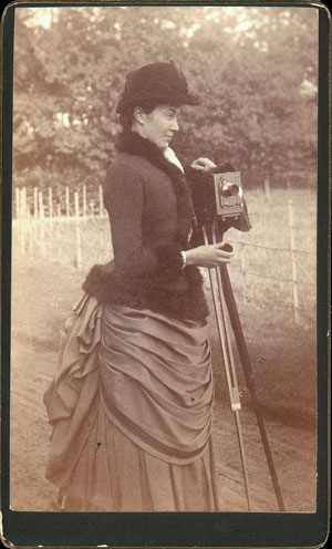 old sepia tone photo, Victorian, of woman with early camera