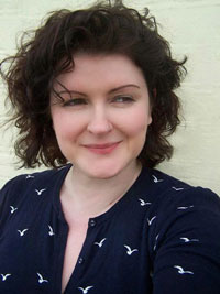author, female, dark hair, smiling