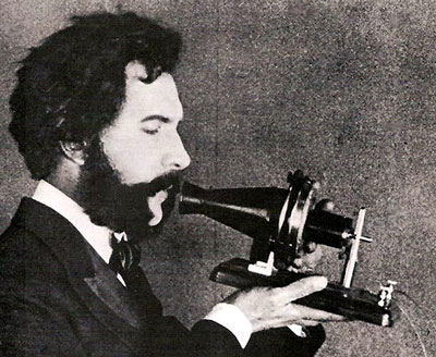 19th century man with beard and early form of telephone