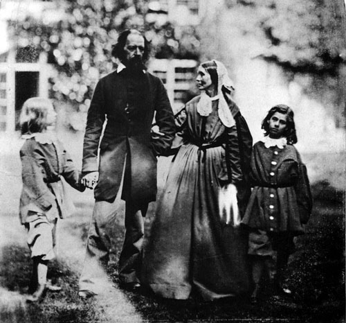 Victorian family group, husband wife with 2 boys walking in garden