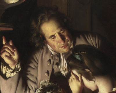 man remonstrating with raised finger