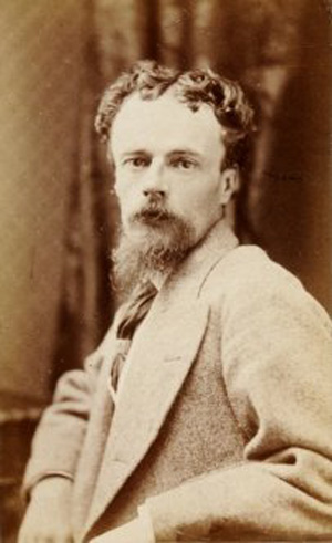 photo of young Victorian man, bearded, head turned to camera