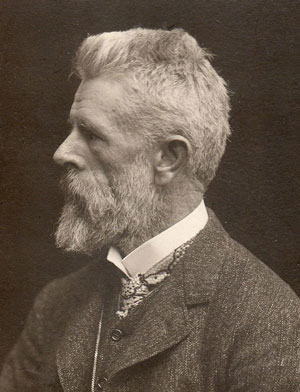 Victorian gentleman with beard, profile, sepia tone photo