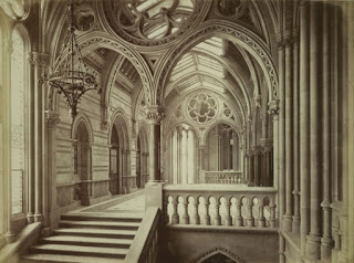 Victorian interior of town hall, vaulted ceilings, arches and wide stairs