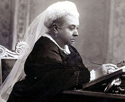 elderly lady, Queen Victoria, seated at writing desk, in thought