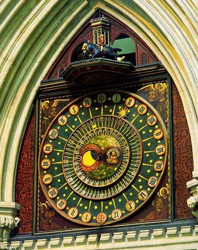 old, early clock on cathedral exterior, Wells