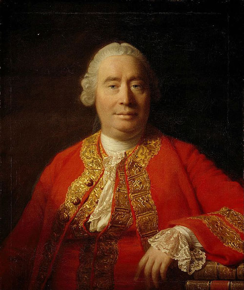 middle-aged Georgian man in bright red tunic and wig