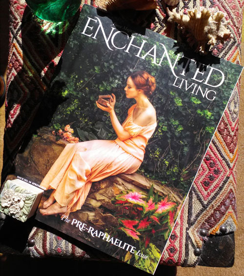 magazine cover shows elegant young woman, seated, opening a small box