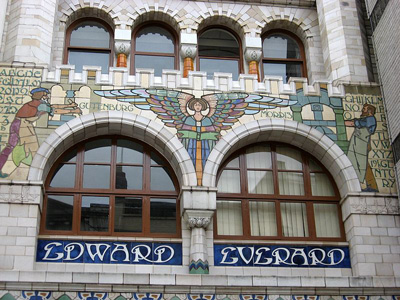 exterior of building with decorative glazed tiles, showing angel with outstretched wings motif