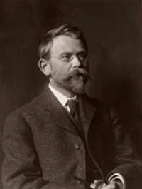 sepia tone photo of gentleman with beard and moustache from early 20th century