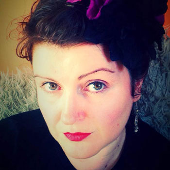 young woman with dark hair, looking up