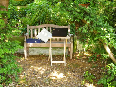 bench and table outdoors in shade