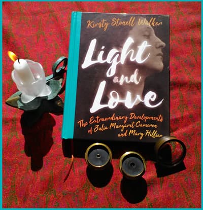 book with background of red shawl