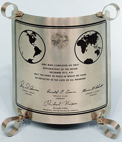 steel plaque left on moon with lettering