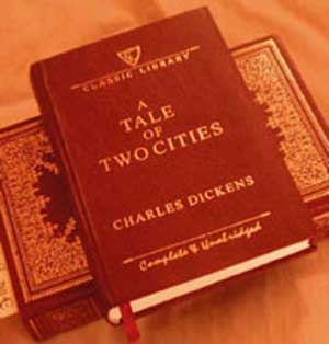Dicken's historical fiction book ATale of Two Cities book cover, red with text