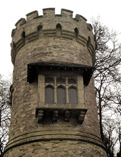 stone tower in Gothic style with oriel window, dark sepia tones