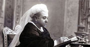 small image of queen victoria at desk, black and white photo